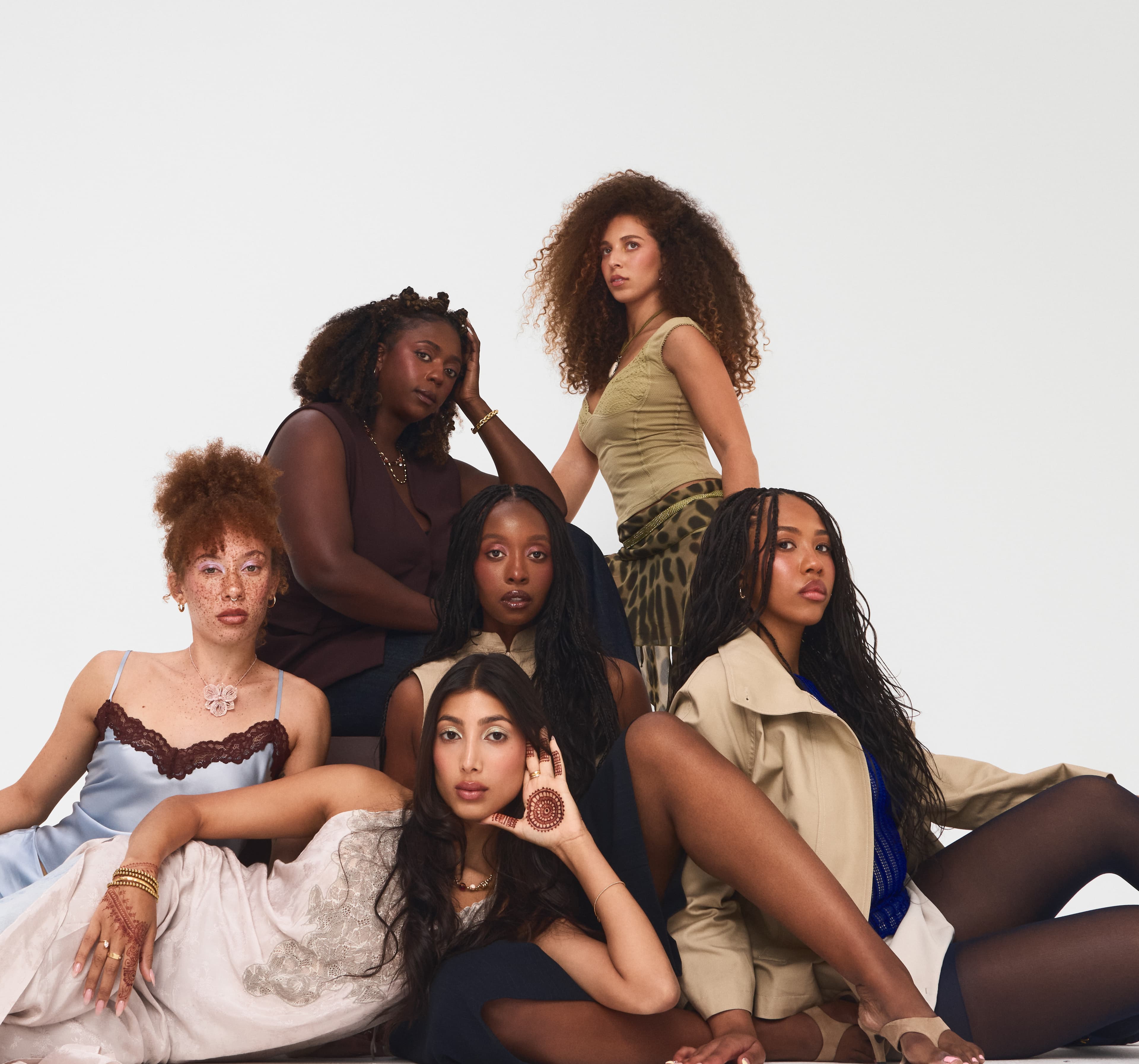 Six women across every shade, seated together for the BRIJD debut campaign